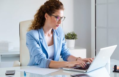 beautiful-businesswoman-working-with-her-laptop-office