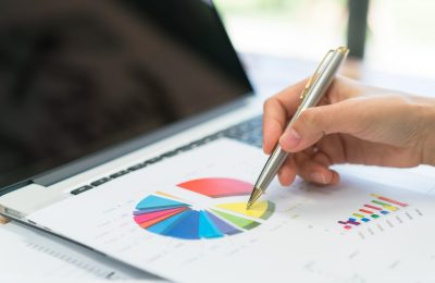 business-people-using-laptop-financial-charts-meeting-office