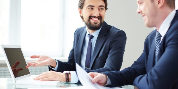businessman-using-laptop-present-report